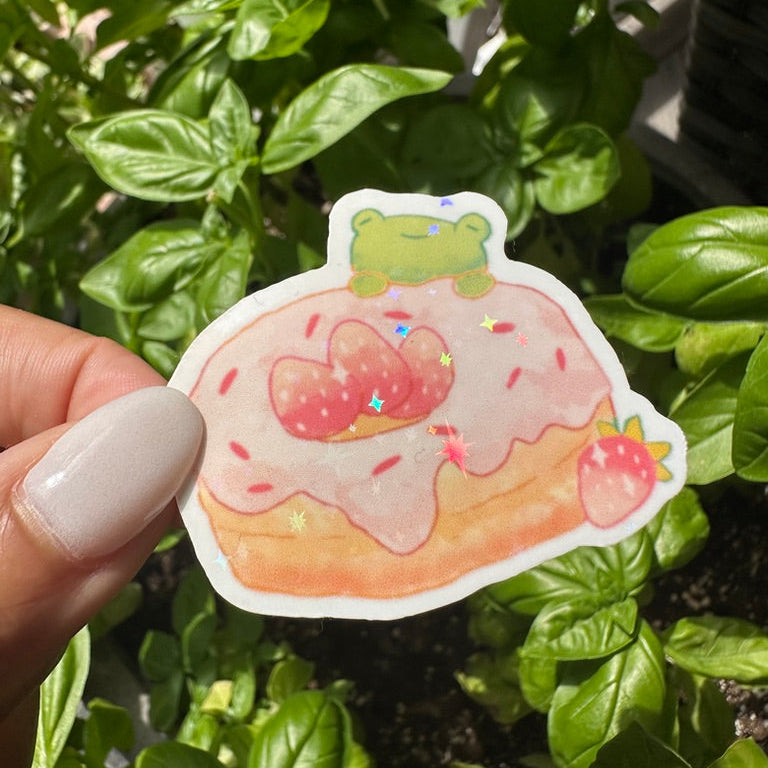 A die-cut sticker featuring strawberry donut and doughnut sticker , set against a background of a cozy garden. Stickers for water bottle, laptop sticker, cute sticker, cool sticker