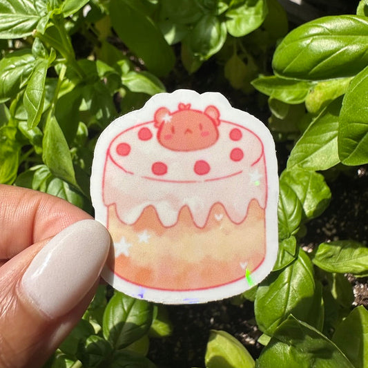 A die-cut sticker featuring a cute bear themed cake sticker , set against a background of a cozy garden. Stickers for water bottle, laptop sticker, cute sticker, cool sticker 
