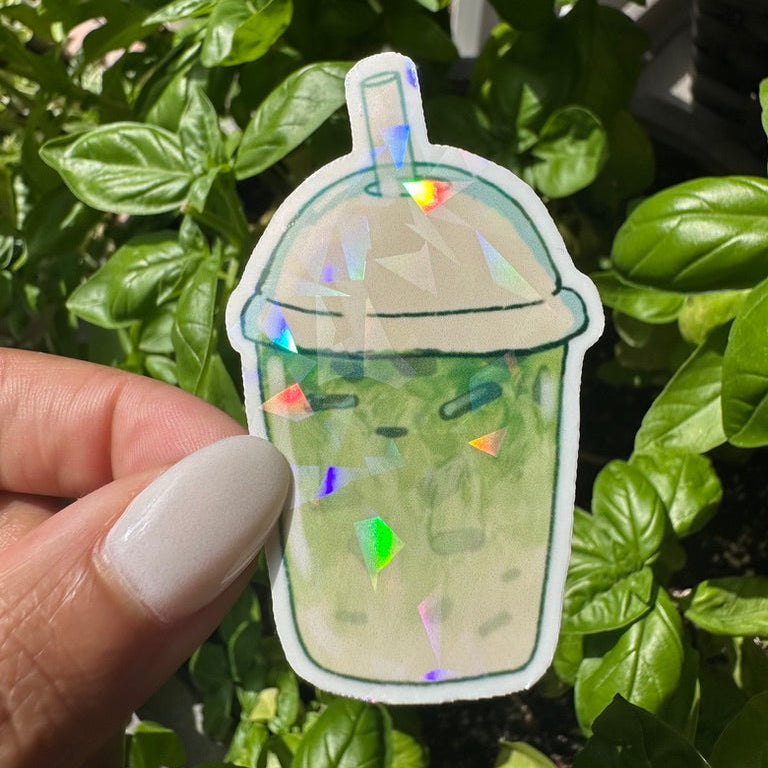 A die-cut sticker of an matcha ice tea drink with cream on top. Stickers for water bottle, laptop sticker, cute sticker, cool sticker