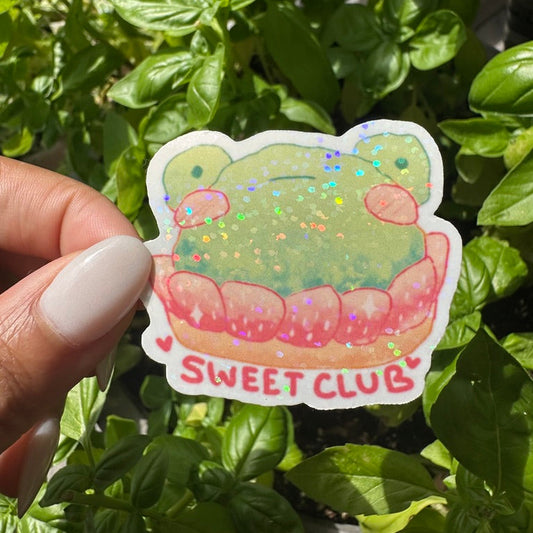 A die-cut sticker featuring strawberry frog danish cake sticker , set against a background of a cozy garden. Stickers for water bottle, laptop sticker, cute sticker, cool sticker 