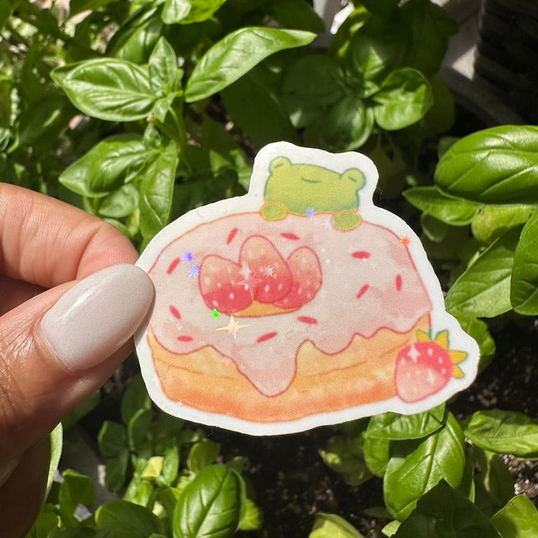 A die-cut sticker featuring strawberry donut and doughnut sticker , set against a background of a cozy garden. Stickers for water bottle, laptop sticker, cute sticker, cool sticker 