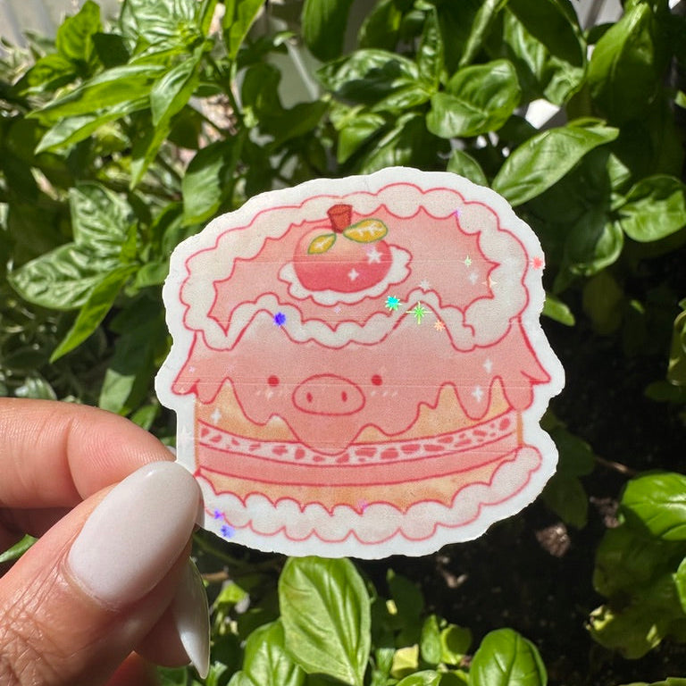 A die-cut sticker featuring a cute pink pig themed cake sticker , set against a background of a cozy garden. Stickers for water bottle, laptop sticker, cute sticker, cool sticker 